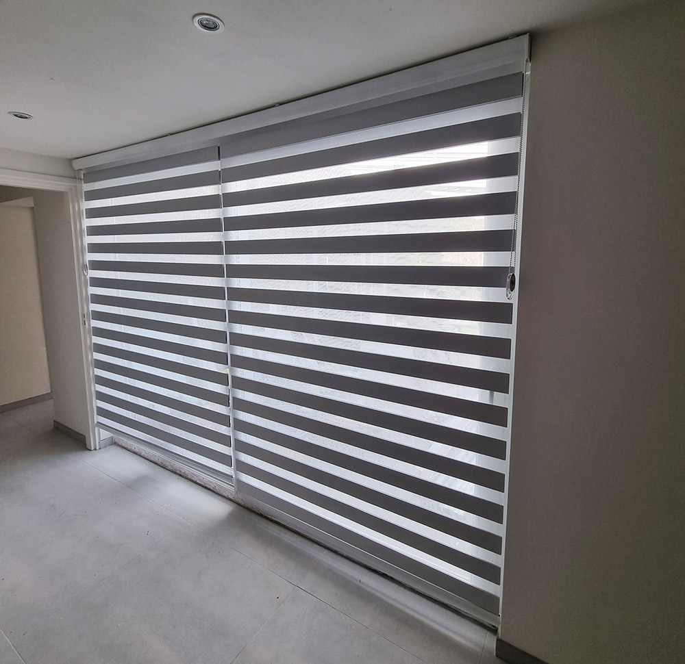 Duorolgordijn deraamdecortie